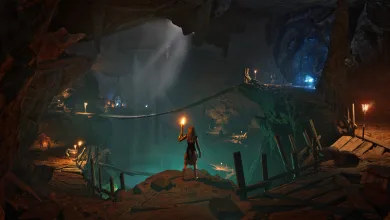 A character holding a torch stands inside a vast underground cavern in Conan Exiles Enhanced