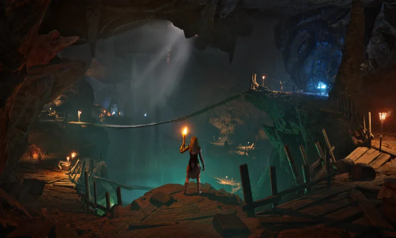 A character holding a torch stands inside a vast underground cavern in Conan Exiles Enhanced