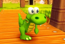 Croc stands on a wooden bridge in a colorful Croc 2 game environment