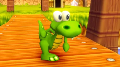 Croc stands on a wooden bridge in a colorful Croc 2 game environment