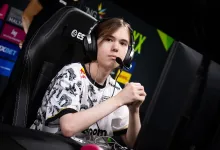 Counter-Strike 2 player donk wearing a headset while seated at a tournament gaming station