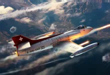 Swiss-marked FFA P-16 fighter flying over mountainous terrain with missiles launching