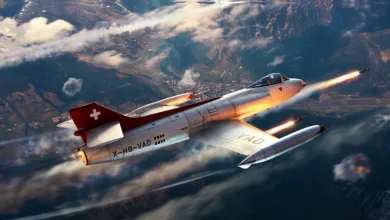 Swiss-marked FFA P-16 fighter flying over mountainous terrain with missiles launching