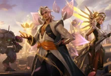 Overwatch 2 heroes Lifeweaver and Mercy stand in a brightly lit futuristic battle scene with a D.Va mech behind them.