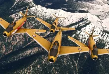A formation of aircraft flying over snow-covered mountains in Microsoft Flight Simulator 2024