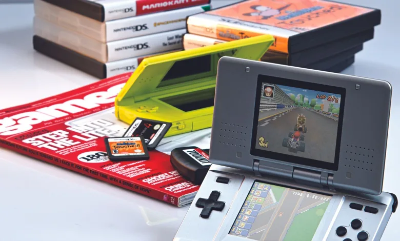 Nintendo DS consoles, games, and accessories arranged on a table