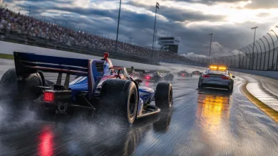 Open-wheel race cars follow a safety car around a wet oval circuit during a caution period.
