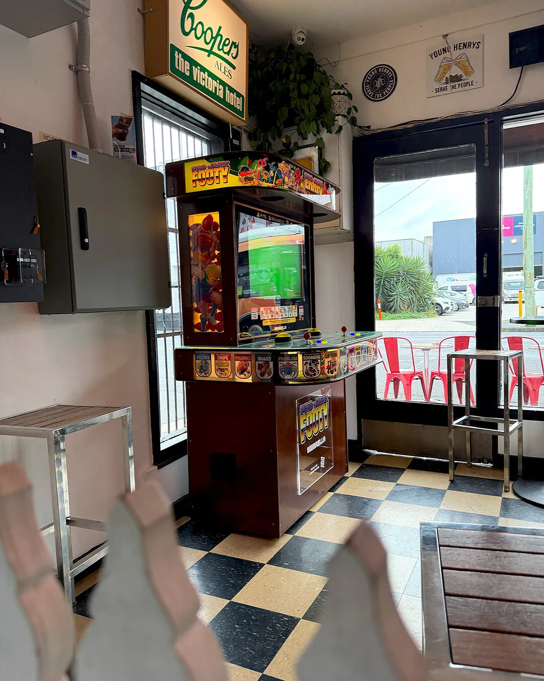 A Pro Jank Footy arcade cabinet inside an Australian pub