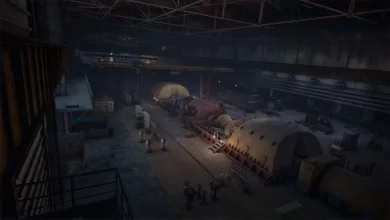 A dark abandoned turbine hall filled with large generators, pipes, railings, and industrial machinery