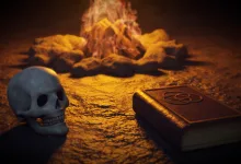 A skull rests beside a glowing campfire and a closed book on a dark stone surface.