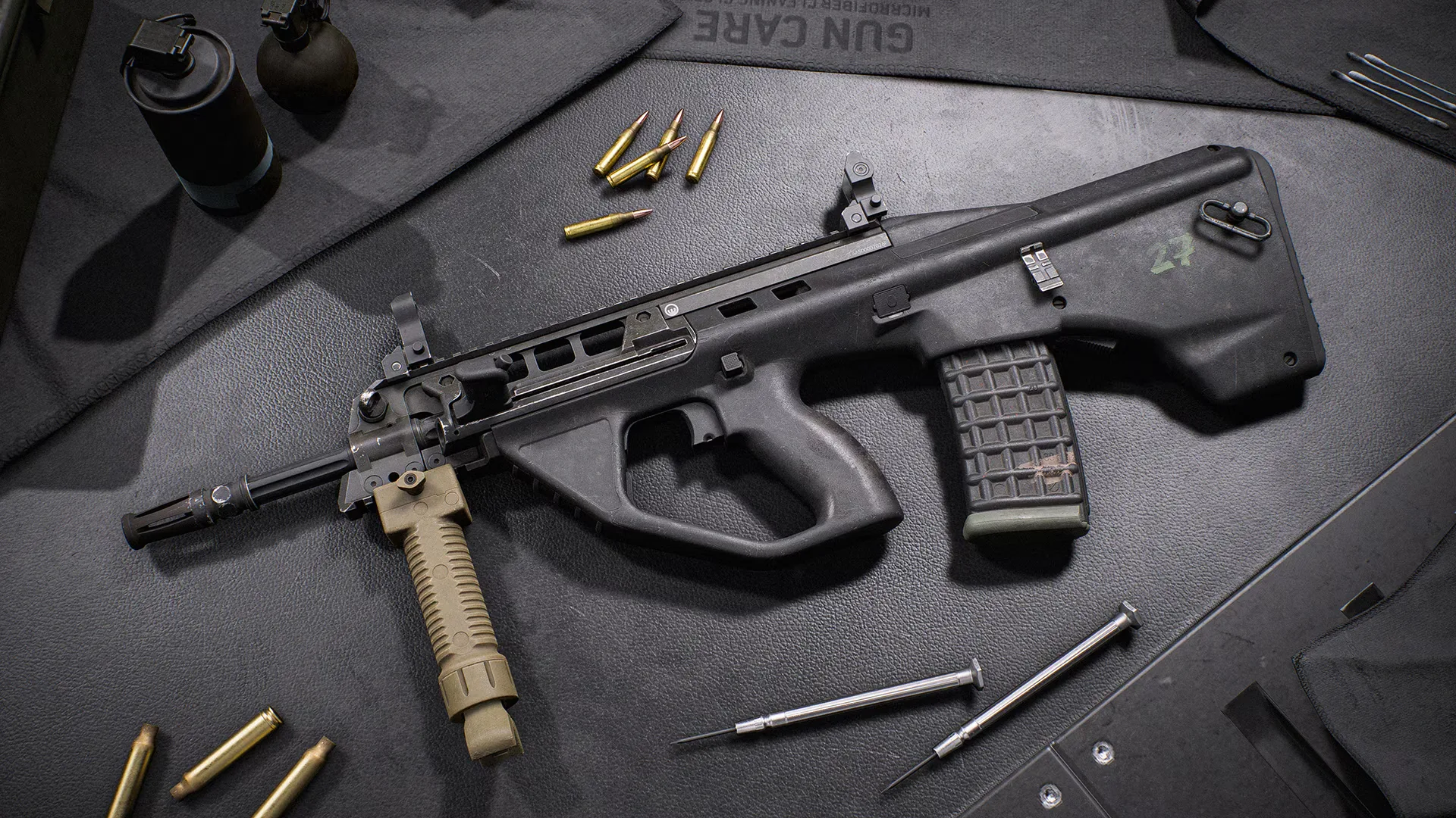 The EF88 bullpup rifle displayed on a workbench with ammunition and tools