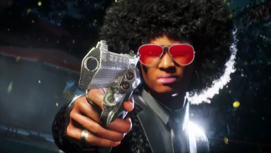 A contestant wearing red sunglasses aims a silver pistol in The Finals.