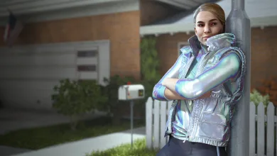 Contestant wearing a shiny silver puffer vest standing outside a suburban house in THE FINALS