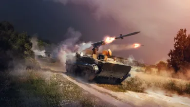 A War Thunder ground vehicle fires missiles while driving along a dusty battlefield road