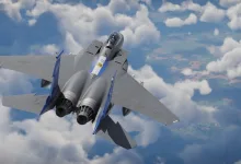 A gray twin-engine fighter aircraft flies above clouds in War Thunder