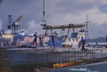 War Thunder ship being worked on at a harbor dock