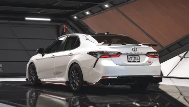 Rear three-quarter view of the white 2023 Toyota Camry TRD in Forza Horizon 5.