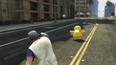 A character throws a Poké Ball at a yellow Pokémon on a Los Santos street in a GTA 5 mod