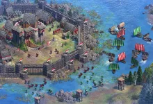 Age of Empires II: Definitive Edition scene showing a fortified coastal settlement surrounded by ships and troops