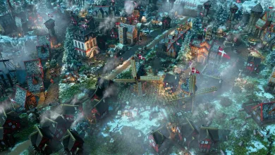 A snowy Danish settlement with red-and-white flags under the northern lights in Age of Empires III: Definitive Edition.