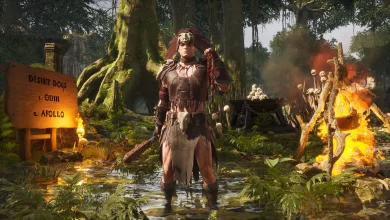 A Conan Exiles character stands in a forest camp beside a Desert Dogs sign and a burning fire.