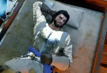 An armored character rests on a bed in Crimson Desert