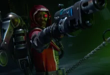 Dawn of War 4 artwork showing a red-hooded armored fighter aiming a large weapon in a dark industrial setting