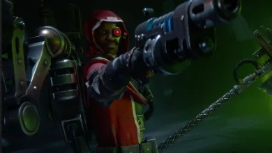 Dawn of War 4 artwork showing a red-hooded armored fighter aiming a large weapon in a dark industrial setting