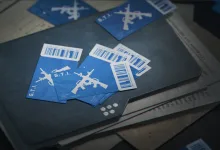 Blue Delta Force voucher tickets featuring weapon graphics on a dark tabletop
