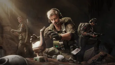 Three Delta Force operators gather around equipment, with a blond operator crouching in the center.