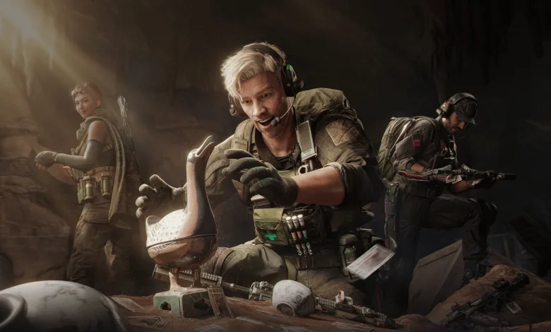Three Delta Force operators gather around equipment, with a blond operator crouching in the center.