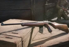 A wood-stock PPT-28 prototype weapon with a box magazine rests on a wooden crate in an Enlisted scene.