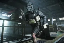 An armored Escape From Tarkov player character moves through an industrial complex with a weapon drawn.
