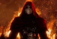 A hooded, masked character stands before flames in Fable.