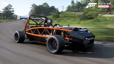 A stripped-down orange-and-black kit car driving on a track in Forza Horizon 6