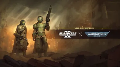 Two armored Helldivers stand in a smoky battlefield beneath the Helldivers 2 and Warhammer 40,000 logos.