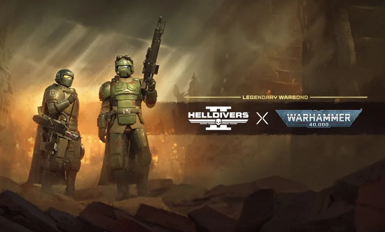 Two armored Helldivers stand in a smoky battlefield beneath the Helldivers 2 and Warhammer 40,000 logos.