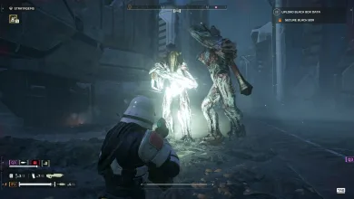 A Helldiver faces two grotesque Illuminate aliens in a dark city street.