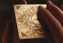 Hands hold the ornate Genesis Configuration puzzle box from Hellraiser: Revival