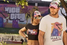 Jason and Lucia stand together in front of a Vice City mural.