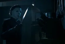 Michael Myers holds a knife in a dark room in Halloween: The Game.
