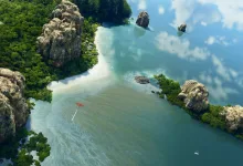 Aircraft flying over a tropical river surrounded by rocky, forested islands in Microsoft Flight Simulator 2024
