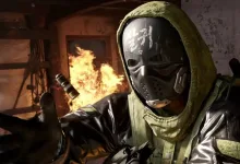 Masked Modern Warfare 4 soldier in a green hood reaching forward inside a burning room