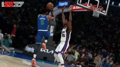 NBA 2K27 gameplay scene showing a player driving toward the basket as a defender contests the shot