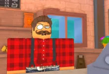 A Roblox cafe worker stands behind the counter in Own a Cafe.
