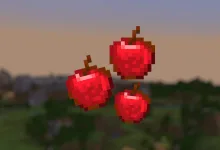 Three pixelated red Minecraft apples floating above a blurred landscape