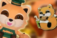 Chef Spiffo plush in a green chef's outfit beside a Spiffo mascot pin.