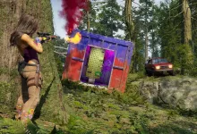 A character aims a rifle at a brightly colored container in a forest while a vehicle approaches in the background
