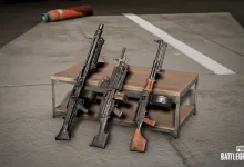 Three PUBG: BATTLEGROUNDS light machine guns displayed on a metal weapon rack.