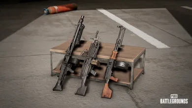 Three PUBG: BATTLEGROUNDS light machine guns displayed on a metal weapon rack.